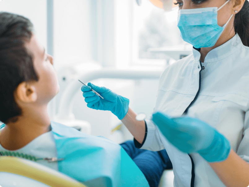 Dental technician working with patient